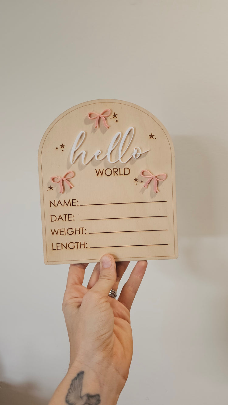 Hello world with bow announcement plaque