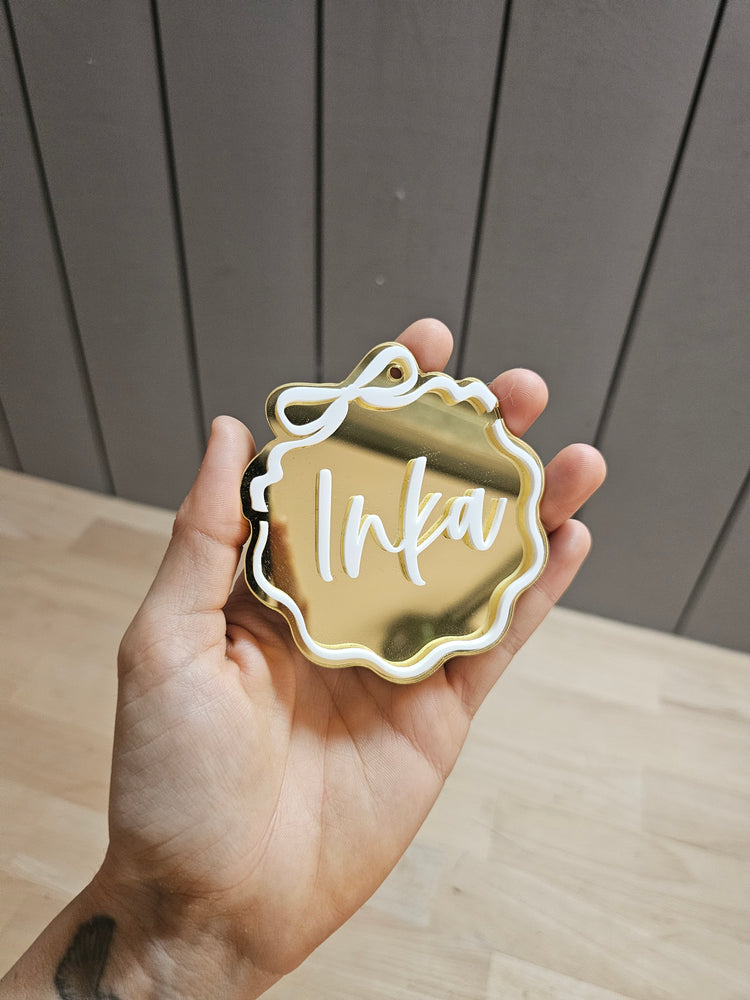 Wavy bow Inka tag